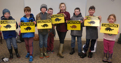 CCC KIDS club helped Mrs. Lindsey paint the Critter Crossing signs