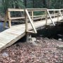 The new bridge, which was built by volunteers and a generous donation by Lowes in Epping, held up to the recent heavy rains and flooding!