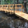 The new bridge, which was built by volunteers and a generous donation by Lowes in Epping, held up to the recent heavy rains and flooding!