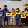 Club members paint the "Critter Crossing" signs to be put along Candia's roads this spring to help protect crossing animals